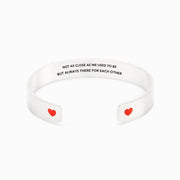 Not as close as we used to be but always there for each other heart bangle